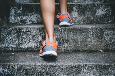 Feet running up stairs