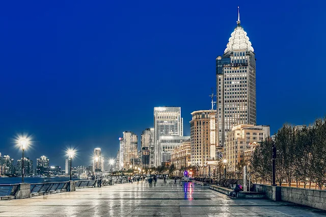 Image Attribute: The file photo of Bund, a famed waterfront promenade in Shanghai, PR China