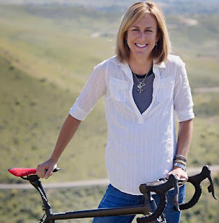 Picture of Kristin Richard with a bicycle