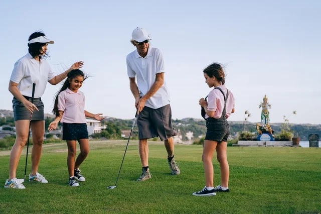 A family playing golf