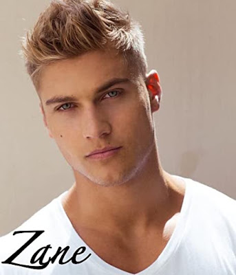 Young blonde man with spiky hair and a white tee shirt the caption reads Zane