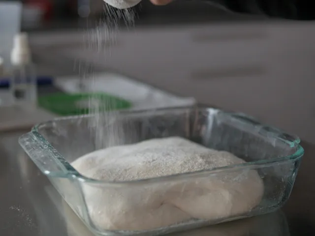 Sprinkle bread flour on top of the dough and work space.