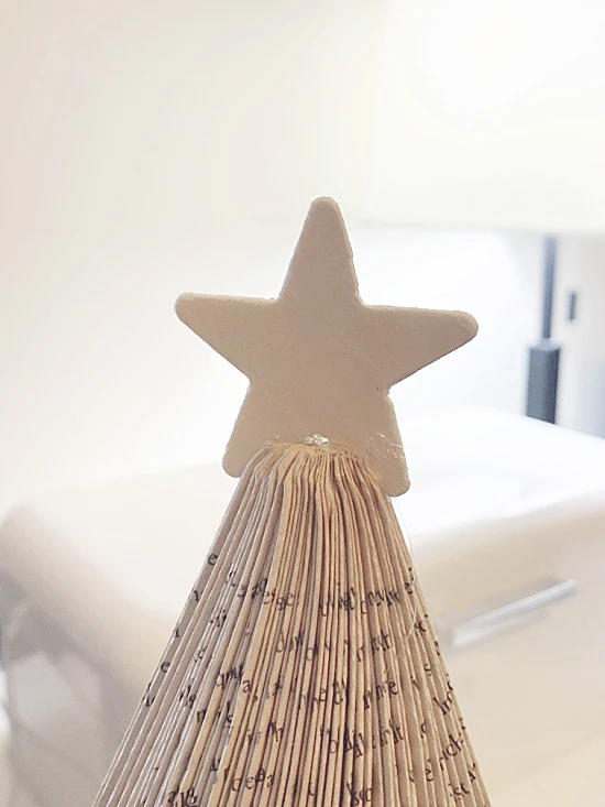 wooden star on top of tree