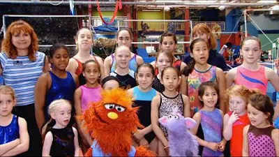 Sesame Street Episode 4422. We see Murray and his lamb Ovejita. They are at a gymnastics school.