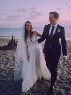 Griffin Cleverly with his wife Bridgit Mendler in their wedding dress