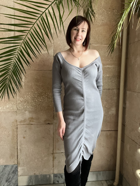 https://femmeluxe.co.uk/grey-ribbed-v-neck-ruched-long-sleeve-bodycon-midi-dress-karen