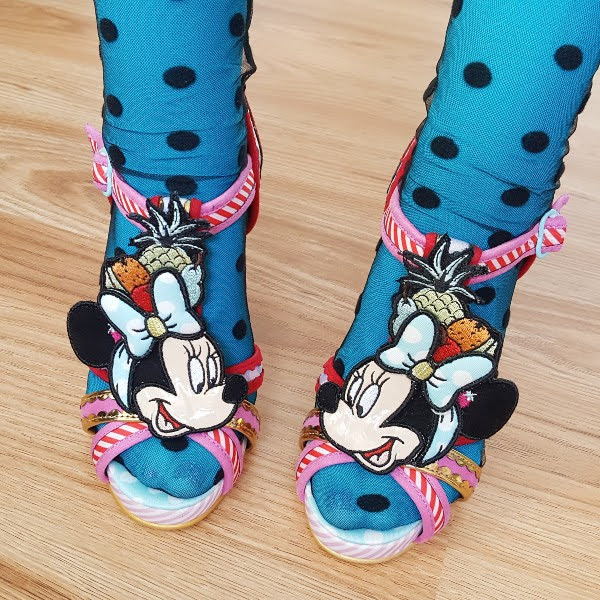 wearing Minnie Mouse sandals and spotty tulle socks and blue tights