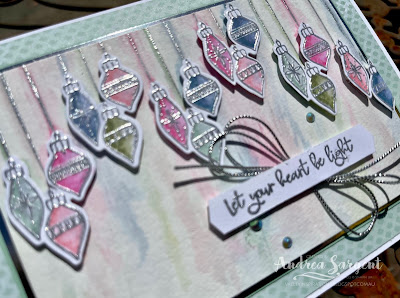"Let you heart be light" with loosely water-coloured hanging baubles.