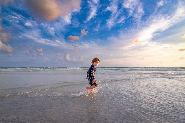 Child paddling in the sea