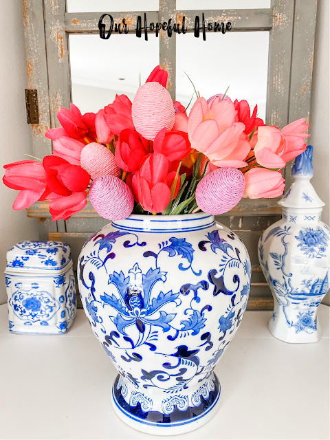 bunches of pink Easter tulips in ginger jar vase