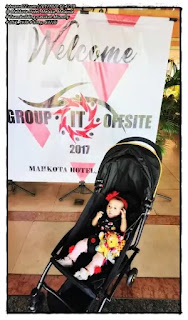 Aina's picture in front of Mummy's Welcome Group IT Offsite 2017 banner.