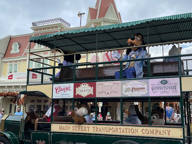 Rainy Day Cavalcade 50th Anniversary Characters Riding The Main Street USA Omnibus Minnie Goofy Walt Disney World