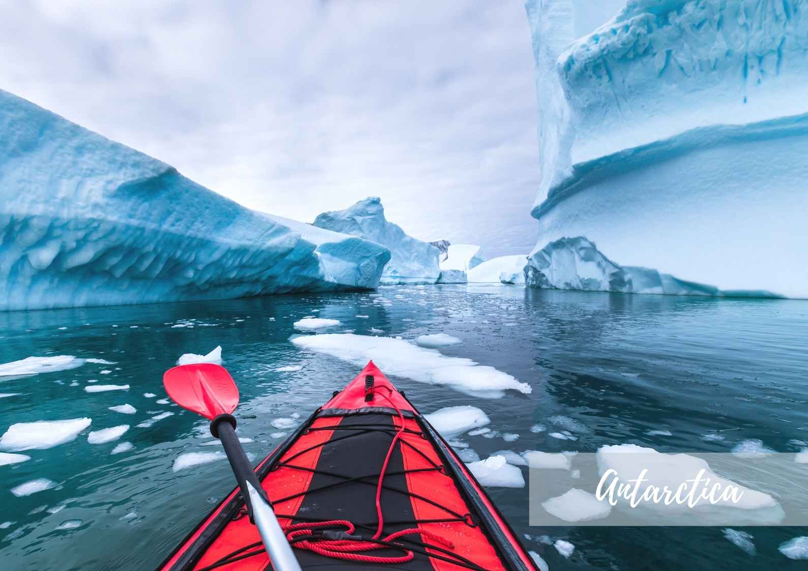 kayaking between icebergs