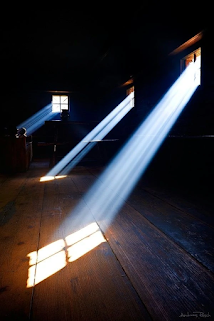 beam of light comin through a window