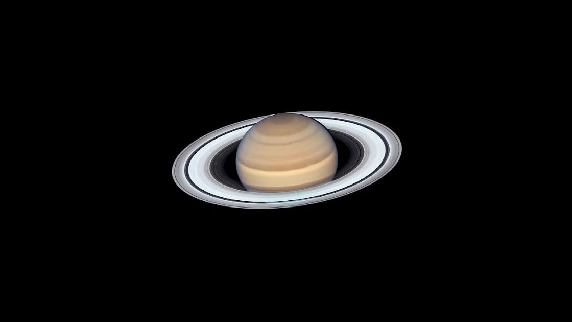 4K high-definition wallpaper of the planet Saturn with its iconic rings, set against a stark black background, perfect for space enthusiasts' desktops.