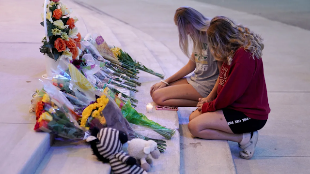 People attend a vigil at Jug Tavern Park following a shooting at Apalachee High School in Winder, Georgia, on Wednesday.