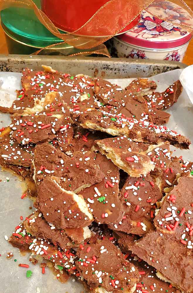 this is a holiday cracker candy ready for Christmas tins called crack candy with chocolate and toffee