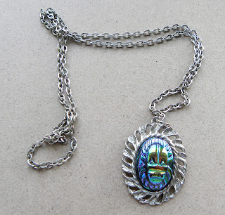 Scarab beetle pendant necklace in titanium colours