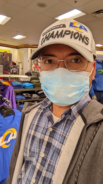 Posing with the Los Angeles Rams' NFC championship baseball cap after I bought it at a local Kohl's department store...on February 15, 2022.