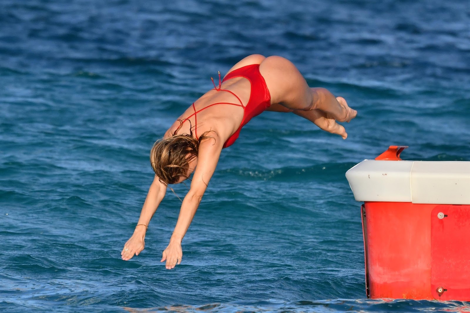 Kimberley Garner showcasing her voluptuous curves in red swimwear on New Year getaway in St. Barts.