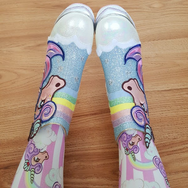 legs in  striped seahorse tights with matching ankle boots