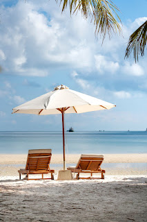 Sand, ocean, and beach chairs