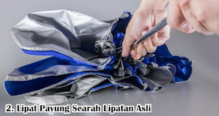 Lipat Payung Searah Lipatan Asli merupakan salah satu tips merawat payung dengan benar