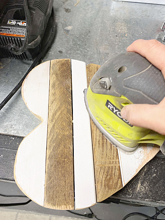 sanding the reclaimed wood heart
