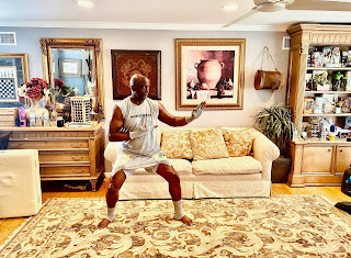 Tomoko Sato's her husband Billy Blanks posing for photo inside the room