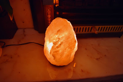 himalayan salt lamp switched on shows beautiful glow from within