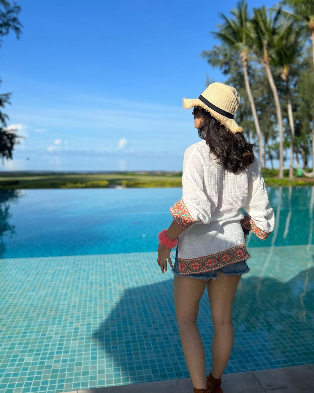 Actress Ashika Rangnath Back Pose with Hat Cap in Thailand :