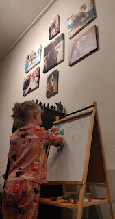 Rosie drawing on her whiteboard