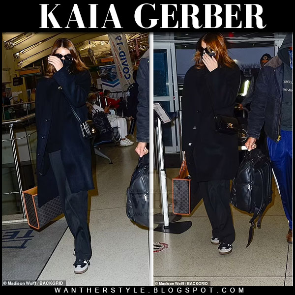 Kaia Gerber in black coat and black trousers