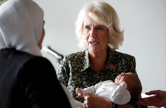 The Duchess wore a green and black Ceropegia Merilis printed shirt dress. Van Cleef and Arpels bracelet