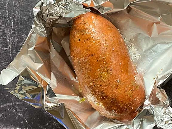 Sweet potato on foil ready to bake