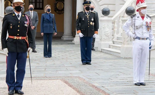 Princess Caroline wore a royal blue double breasted blazer pantsuit with 4 brass buttons, royal blue silk pussy-bow shirt