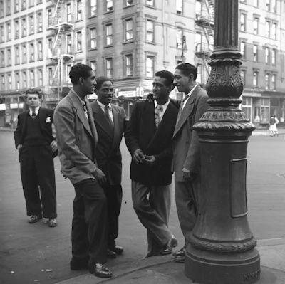 four well-dressed men by street lamp in Spanish Harlem, New York c.1946