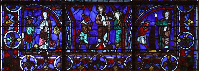 Jesus' Temptation in stained glass window at the Chartres Cathedral