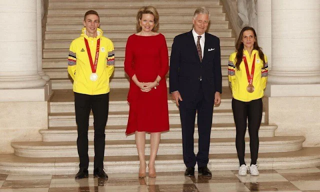 Queen Mathilde wore a red ruffled midi dress from Natan. King Philippe and Queen Mathilde held a reception at the Castle of Laeken