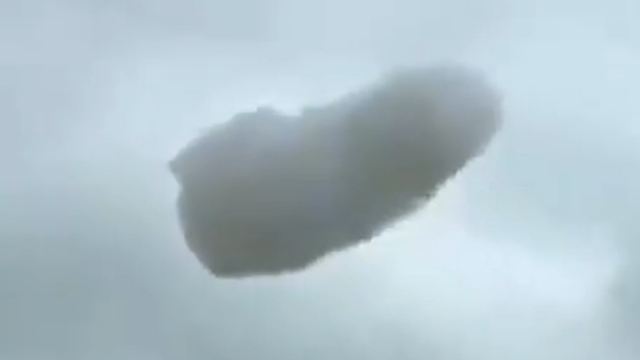Bizarre looking cloud UFO shocked a lady driving her car.