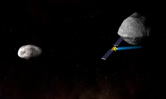 Impresión artística de la nave espacial Double Asteroid Redirection Test (DART) de la NASA acercándose a toda velocidad al más pequeño de los dos cuerpos del sistema de asteroides Didymos. Crédito: NASA/Johns Hopkins University Applied Physics Laboratory