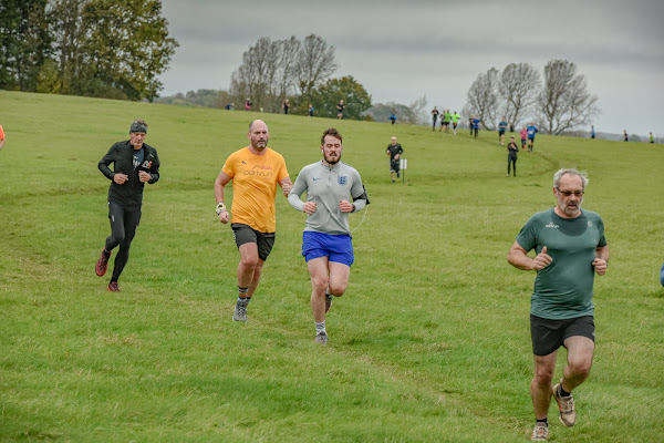 Ian running down the hill towards the finish funnel