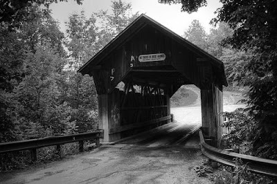 Black and White Photograph of an old Covered Bridge