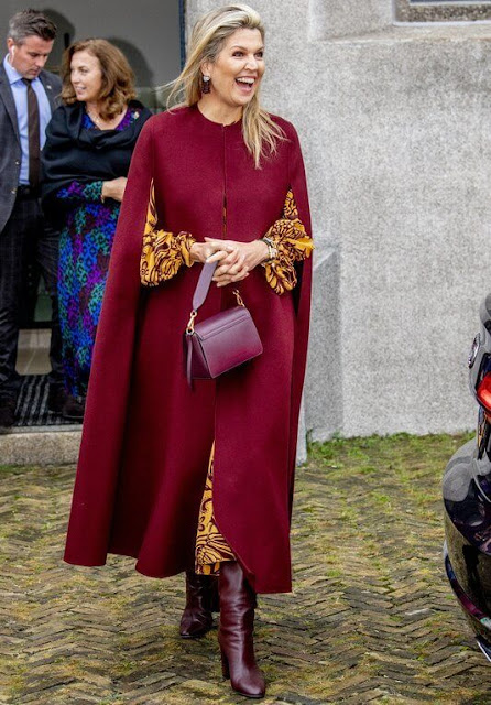 Queen Maxima wore a botanical-print silk maxi dress from Johanna Ortiz, and red wool cape from Natan