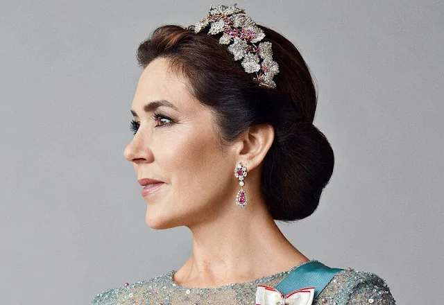 Crown Princess Mary wore a pearl lace dress by Lasse Spangenberg Copenhagen. The iconic ruby jewelry set. The acrostic bracelets