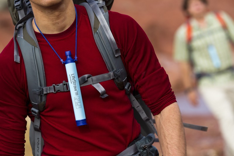 Man wearing lifestraw personal water filter around neck