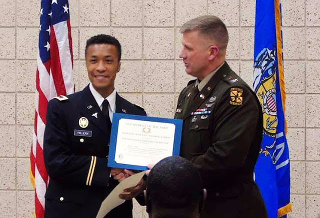 2nd Lt. Hillery at the official Army commissioning ceremony receiving his certificate that says “distinguished” military graduate because he was in the top 20% of cadets worldwide. (Photo credit: Courtesy of Army 2nd Lt. Brandon Hillery, USU)