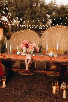 sweetheart table with two peacock chairs