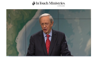 image -  Dr. Charles Stanley - Preaching on Triumphant Joy He is standing behind a podium andwearing a blue suit and glasses