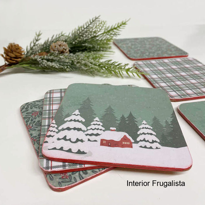 How to recycle old coasters with decoupage green and white woodland themed winter snow scene scrapbook paper into cozy winter drink coasters.